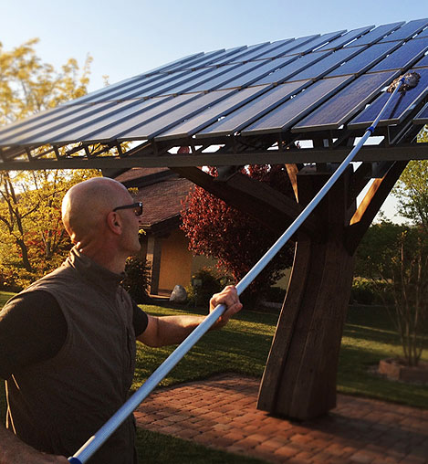 Solar panel cleaning service on roof